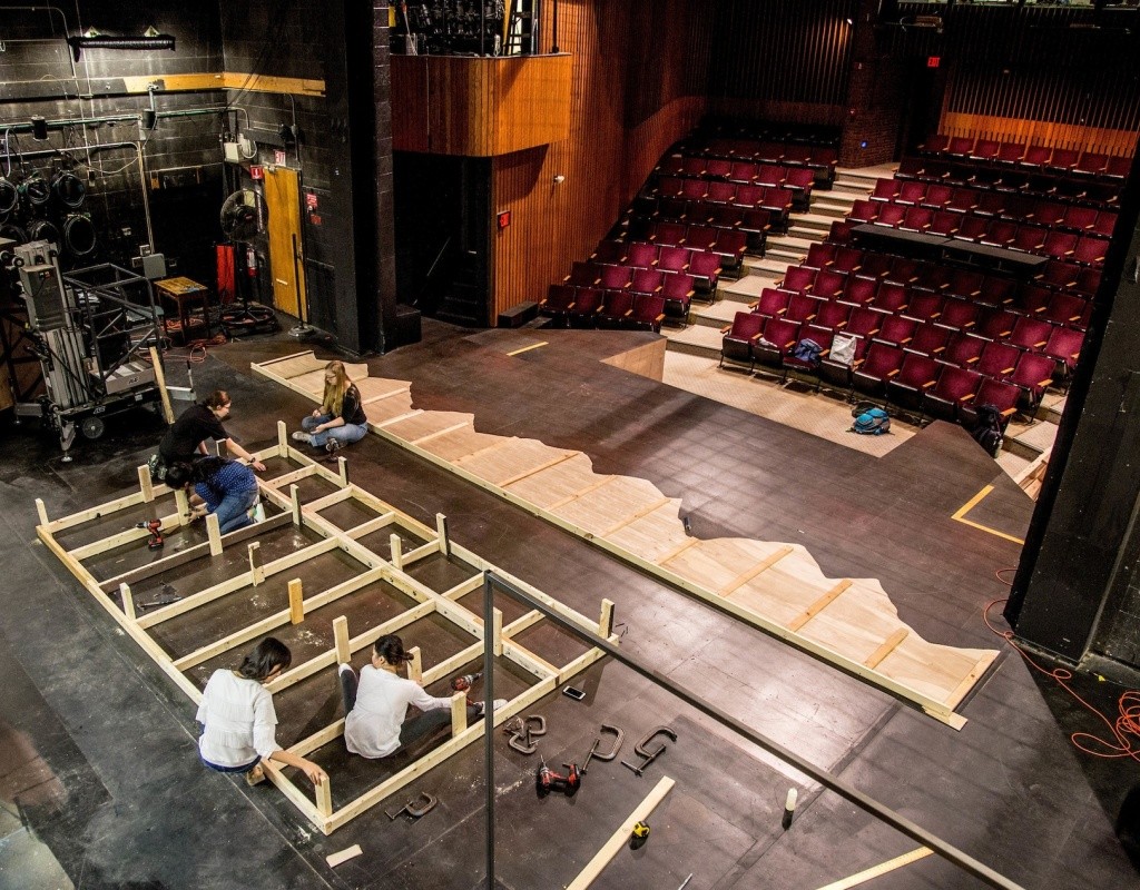 Students building a set in Rooke Theater