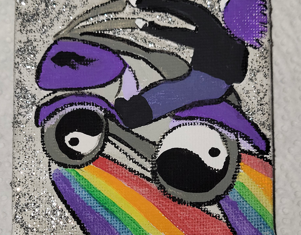 A Kindess Square with a painting of a person riding a bike with rainbows coming from the wheels