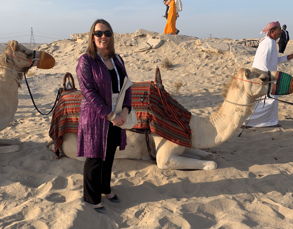 Alumnae Association Executive Director Trisha Tanner ’00 preparing for a camel ride in the Al Wathba Desert