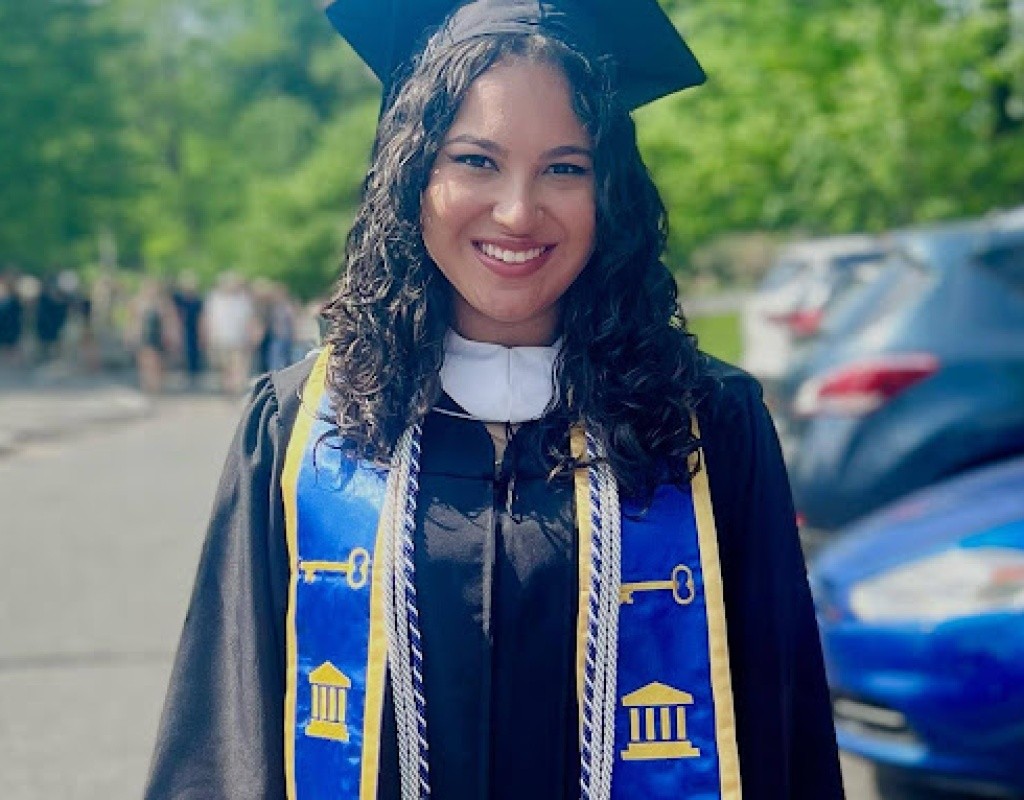 Smiling Posse Scholar in regalia