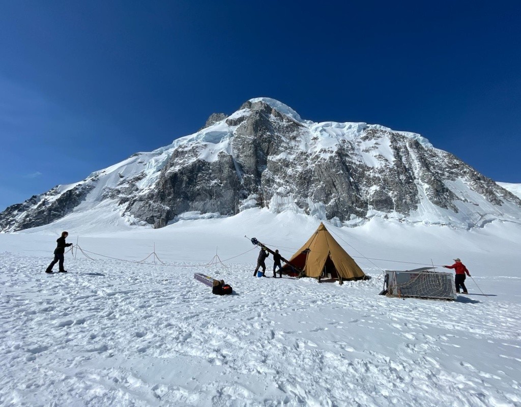 Bridget Hall ’24 working to put up the drill tower on a glacier.