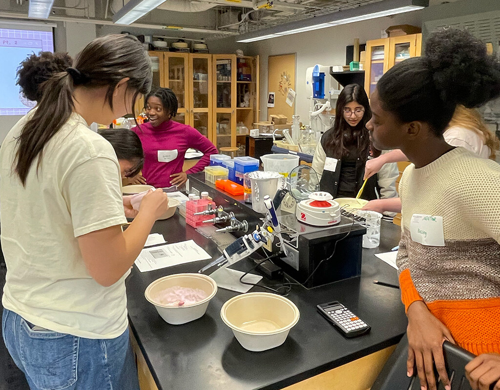 MHC students find fun in measuring ingredients.