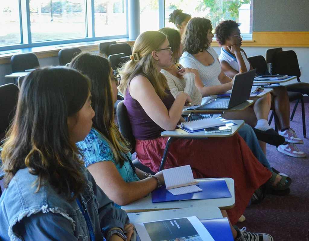 Student attendees listen to a panel presentation during the Money &amp; Mindfulness conference.