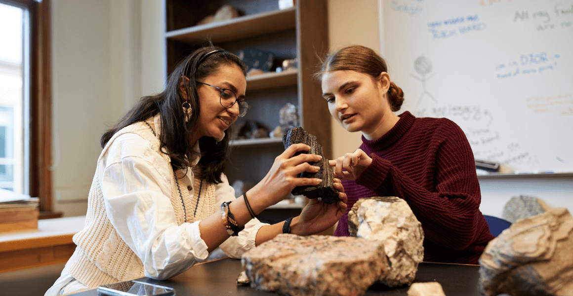 Geology students studying rocks in the rock lab