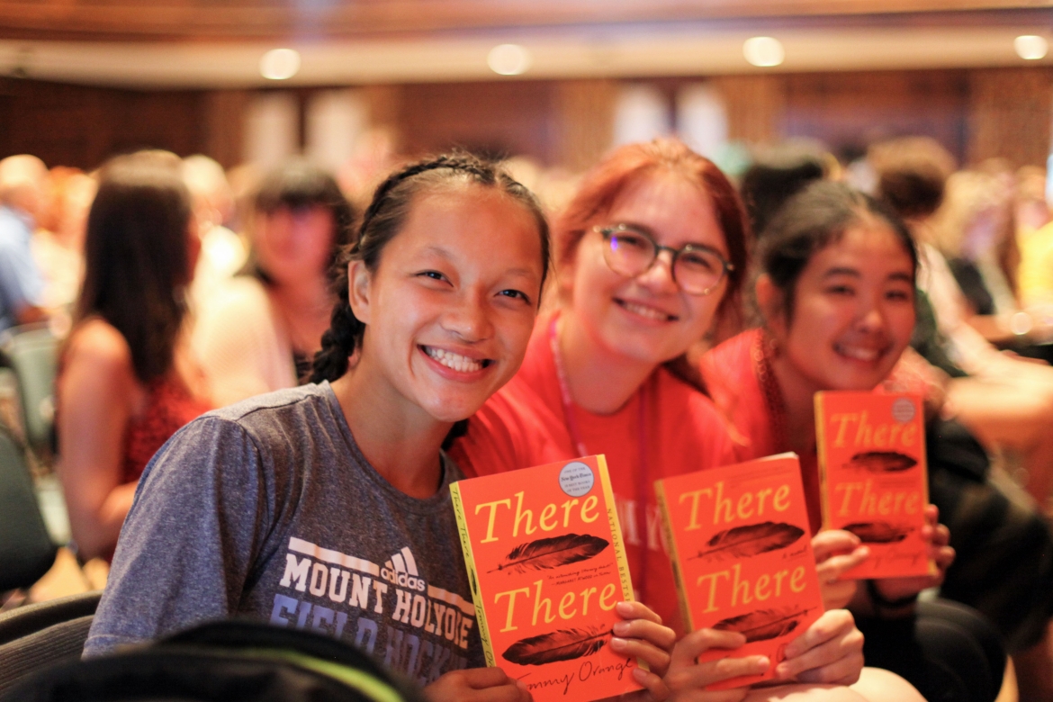 Students holding up their copies of There, There by Tommy Orange