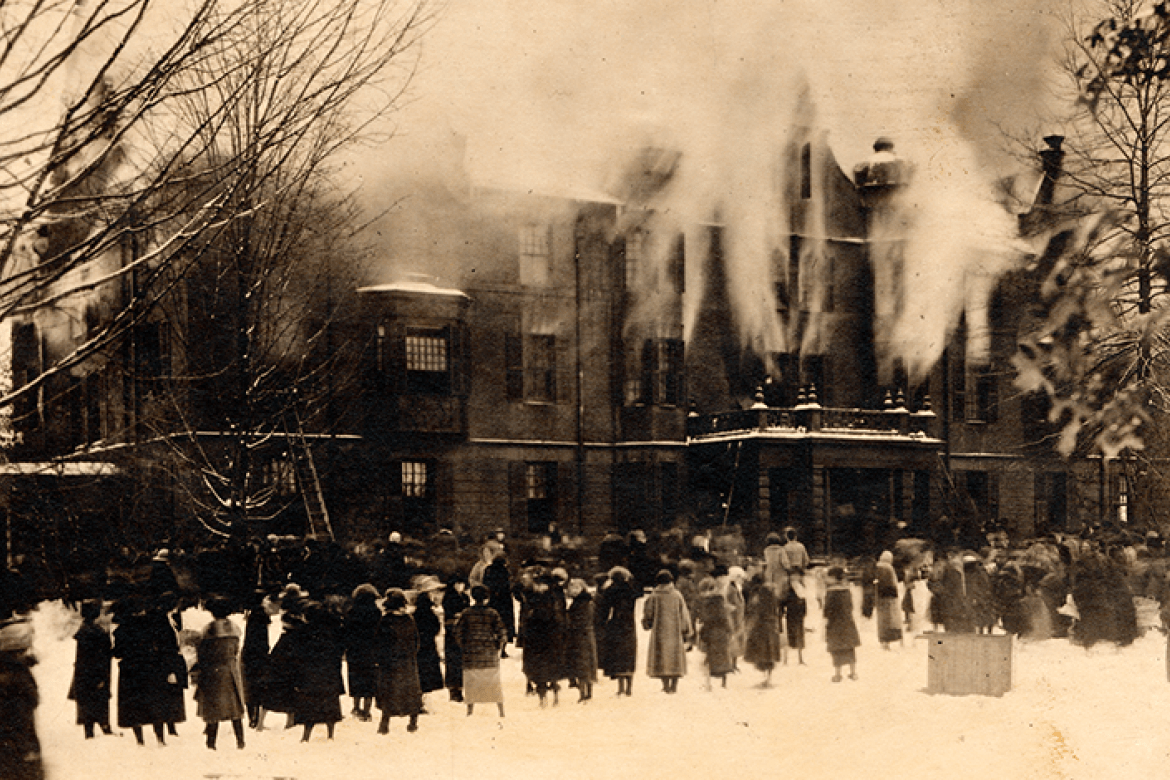 A photograph of the fire at the old Rockefeller Hall on December 21, 1922, while students look on.