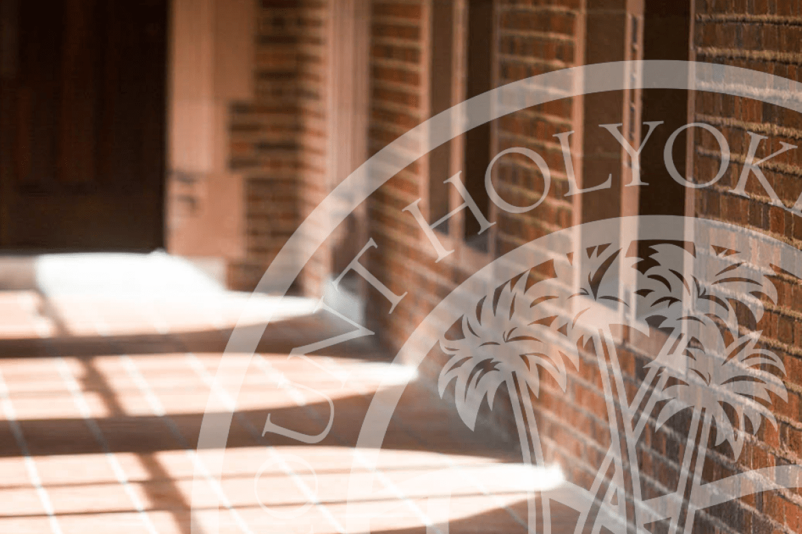 A hallway on the Mount Holyoke campus with the presidential seal overlay