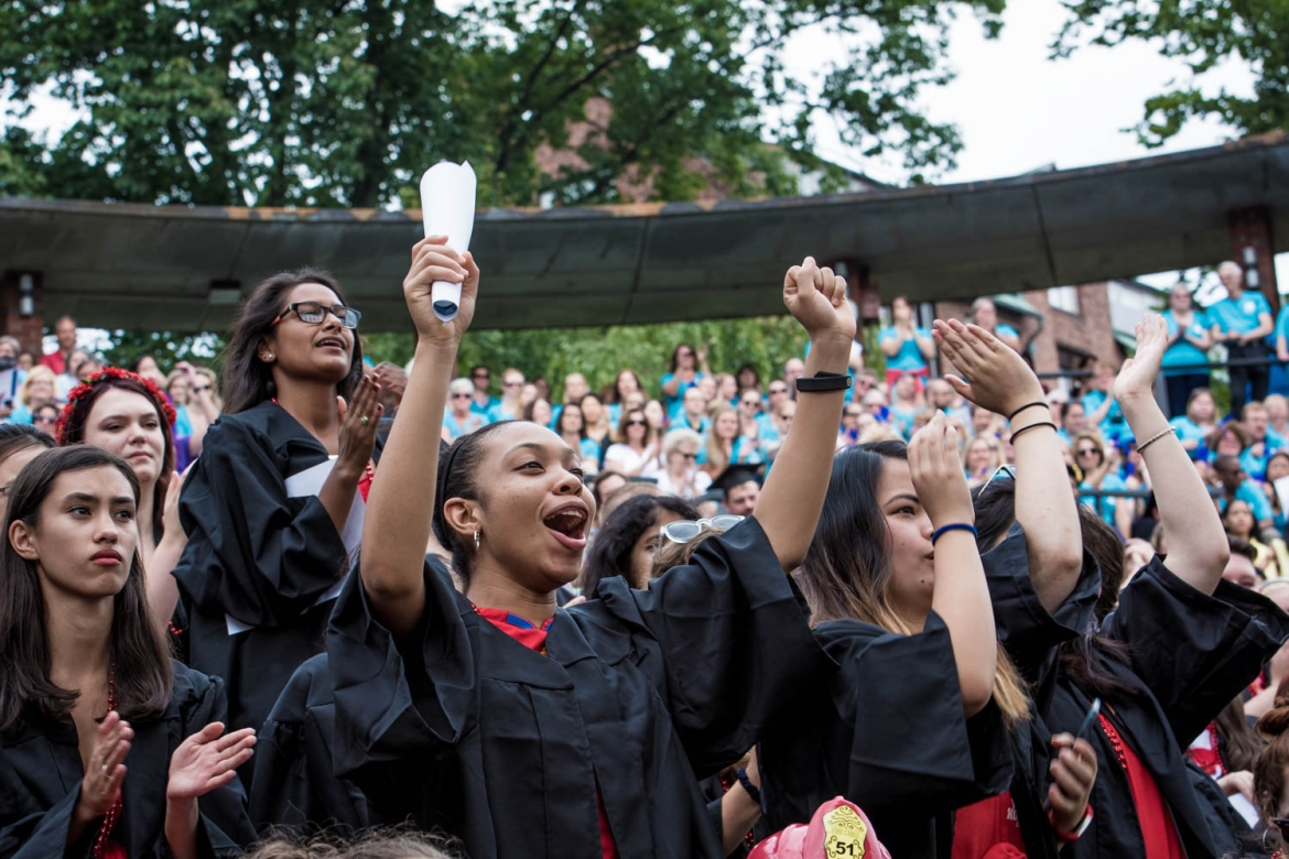 Students standing and cheering during convocation