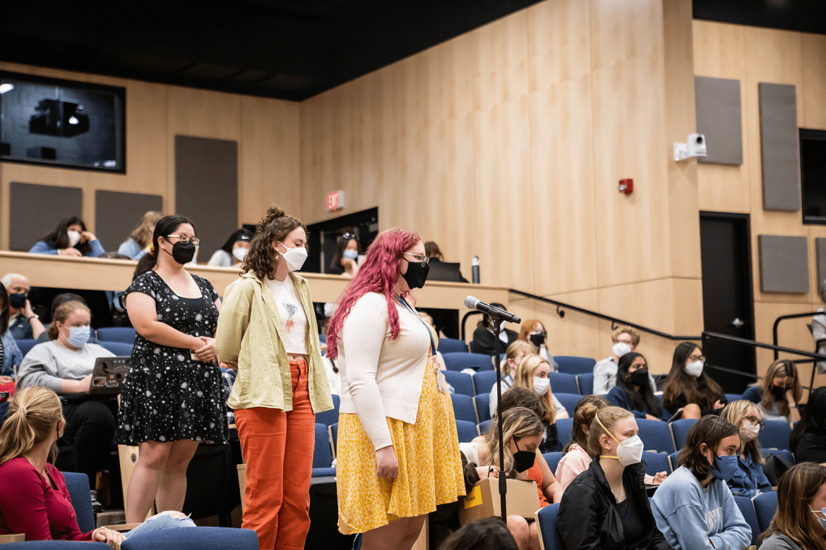 Students preparing to ask questions at the After Roe panel discussion