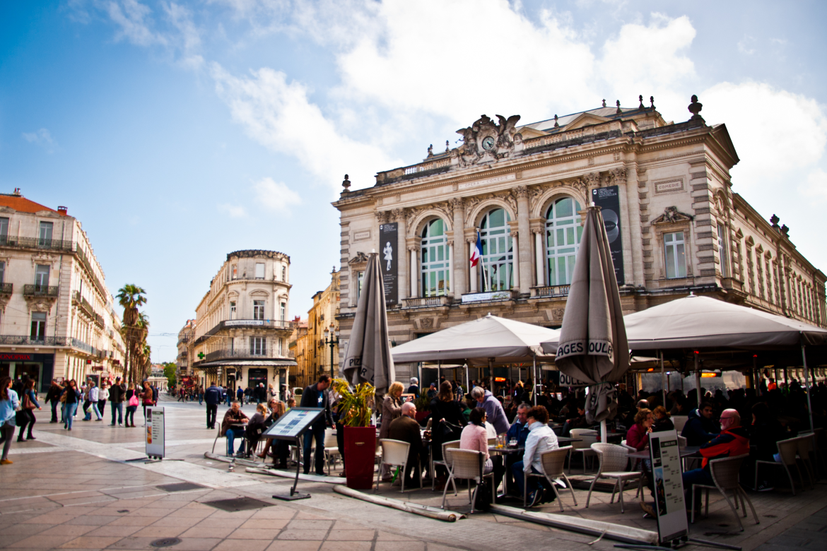 Downtown Montpellier, France with people seated at an open air cafe