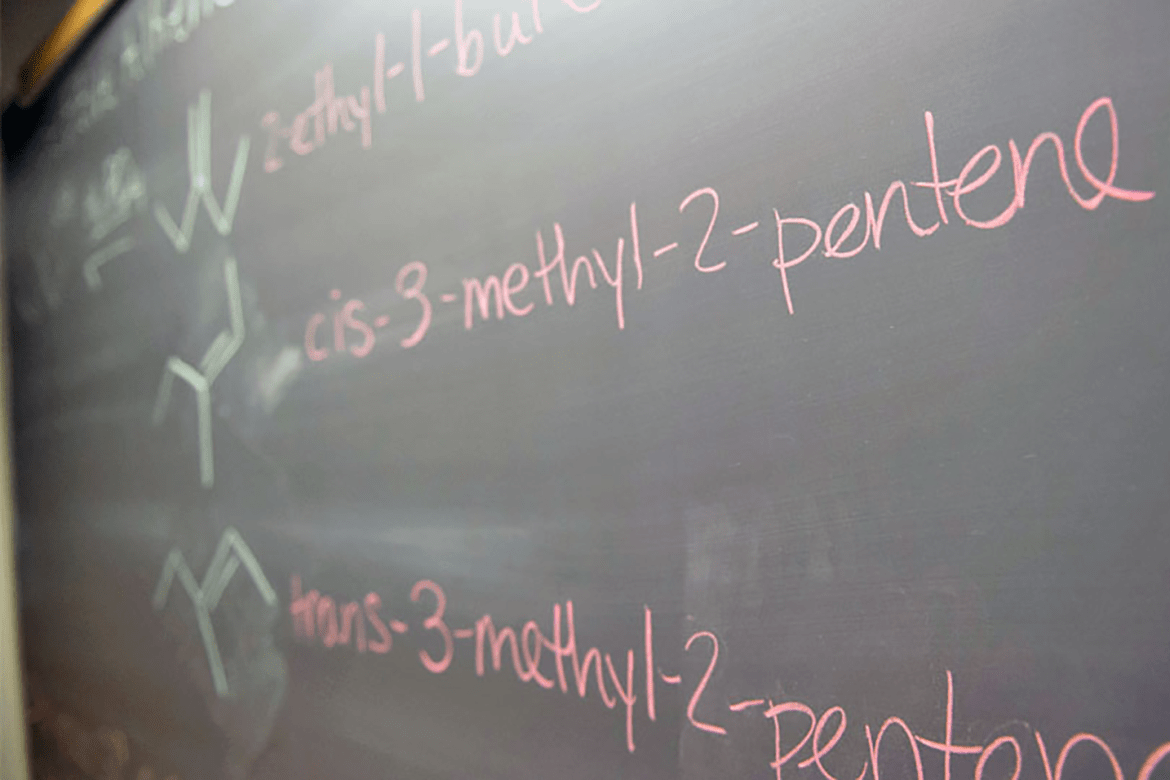 Chemistry terms written on a chalkboard