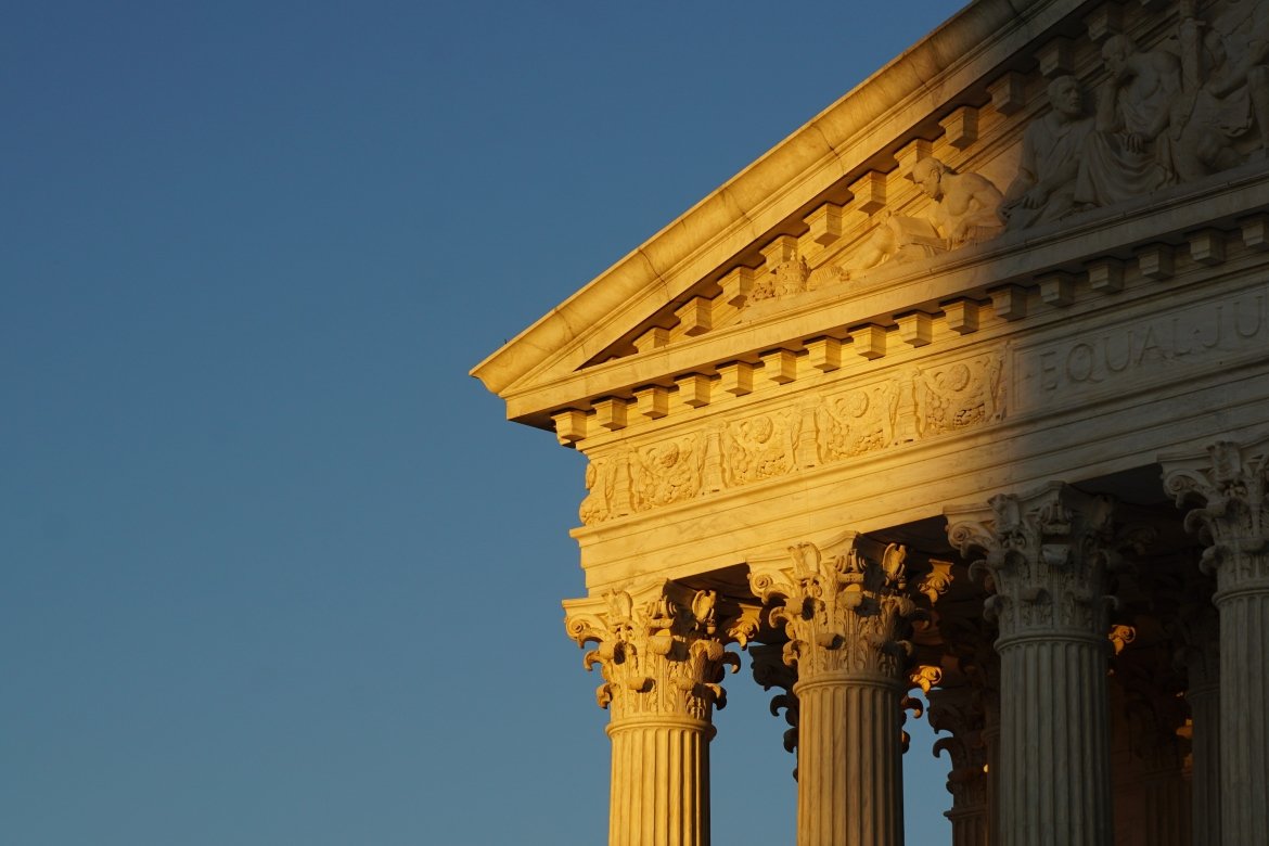 An image of the Supreme Court in the fading sunlight.