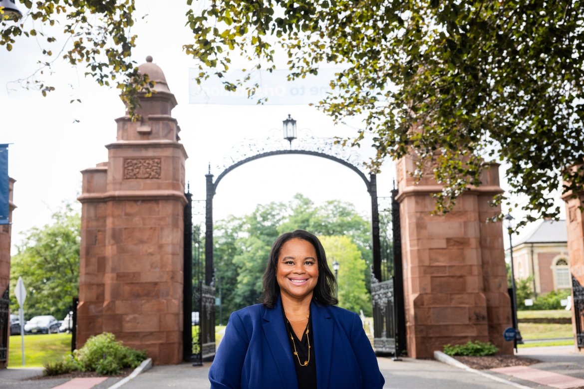 President Danielle R. Holley in front of the Mount Holyoke gates during move-in