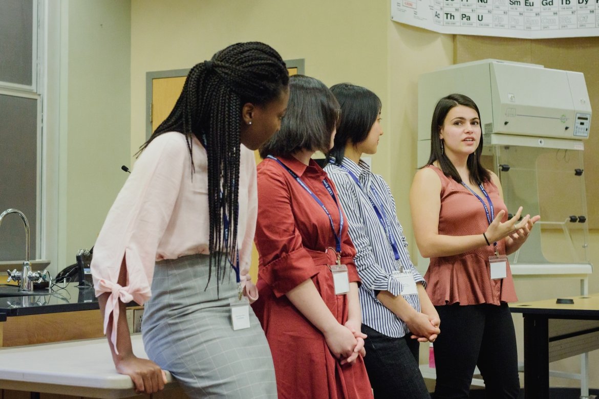 Students presenting information at a scholarship conference at Mount Holyoke College