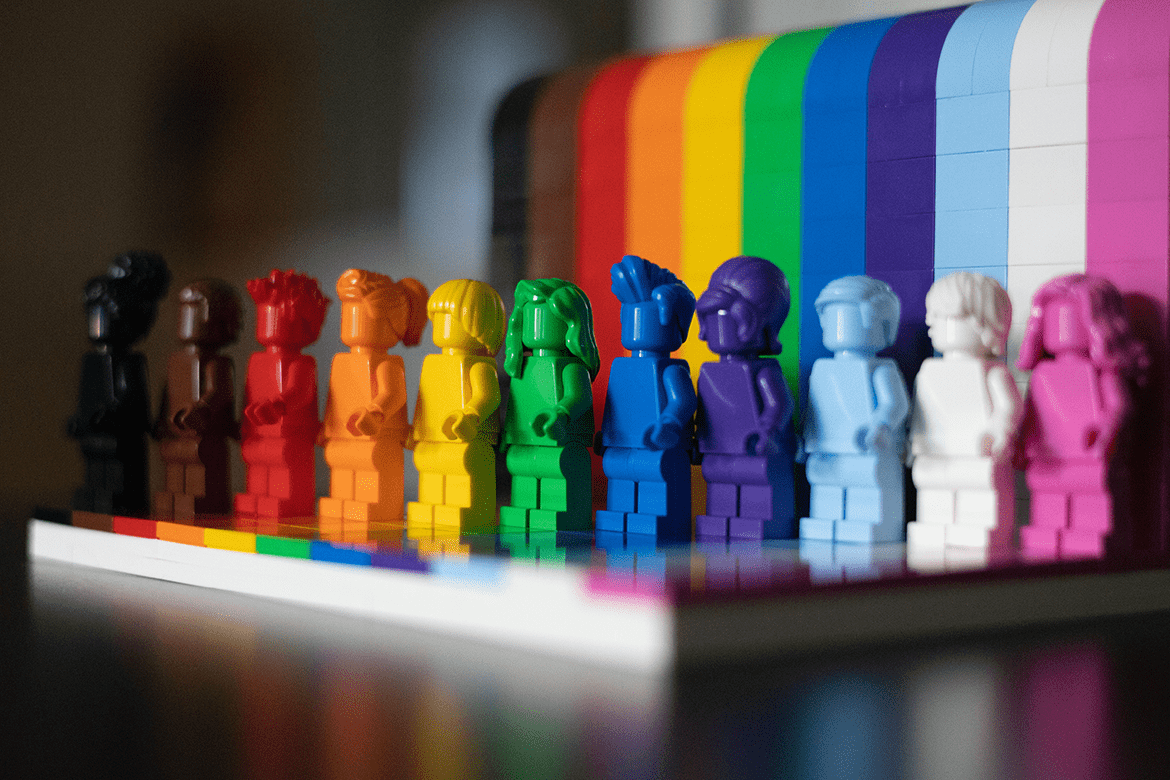 A colorful array of Lego figures arranged in the colors of the rainbow. Photo by James A. Molnar on Unsplash.