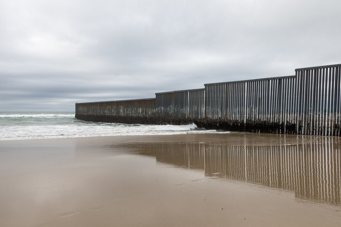 Mexico-US border wall at Tijuana, Mexico. Image courtesy of Tomas Castelazo, www.tomascastelazo.com, via Wikimedia Commons.