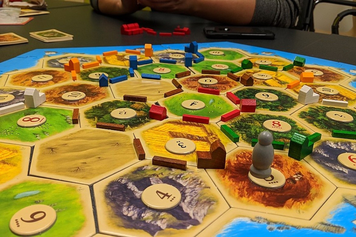 A game of Settlers of Catan. Courtesy of Yongho Kim via Wikimedia Commons.