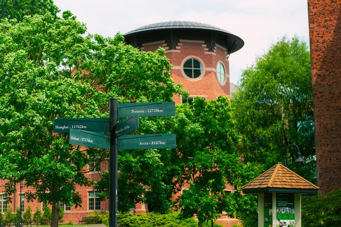 Campus buildings with wayfinding signs