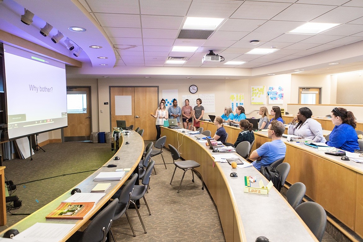 Professional and Graduate Education students at Mount Holyoke College presenting on their work.