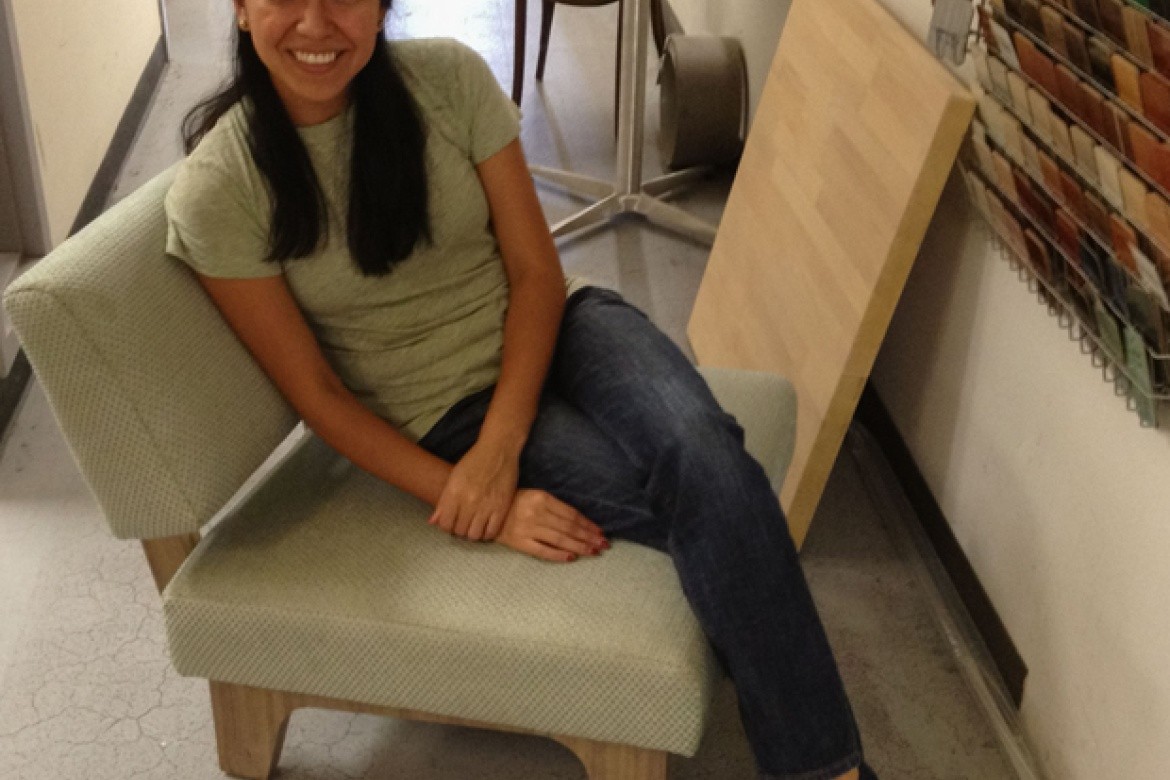Aleida sitting in a mock-up of a custom chair designed by Thread Collaborative. After confirming all dimensions and judging the chair's overall comfort, the mock-up was approved and moved into production.