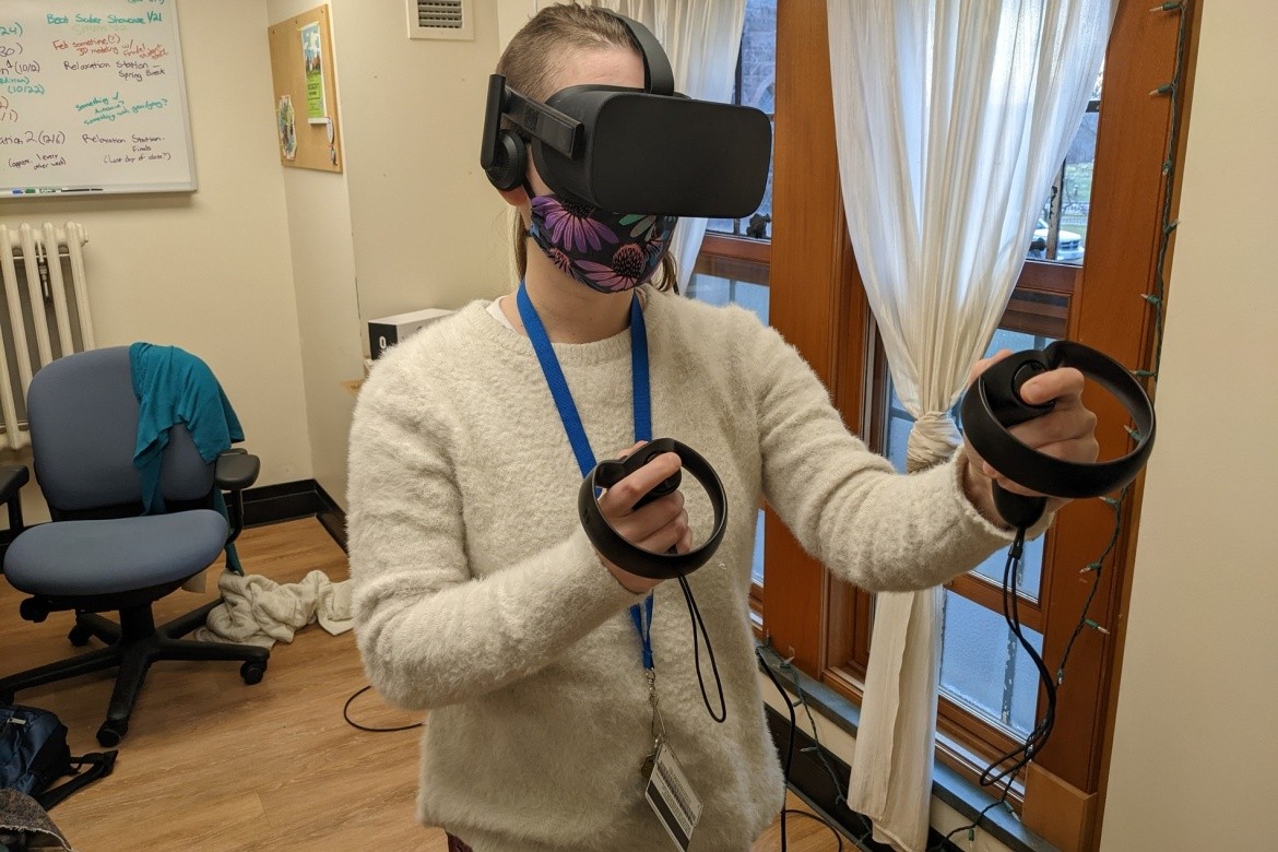 Stephanie Friedman, instructional technologist and specialist in emerging technologies for LITS, demonstrates the VR headset.
