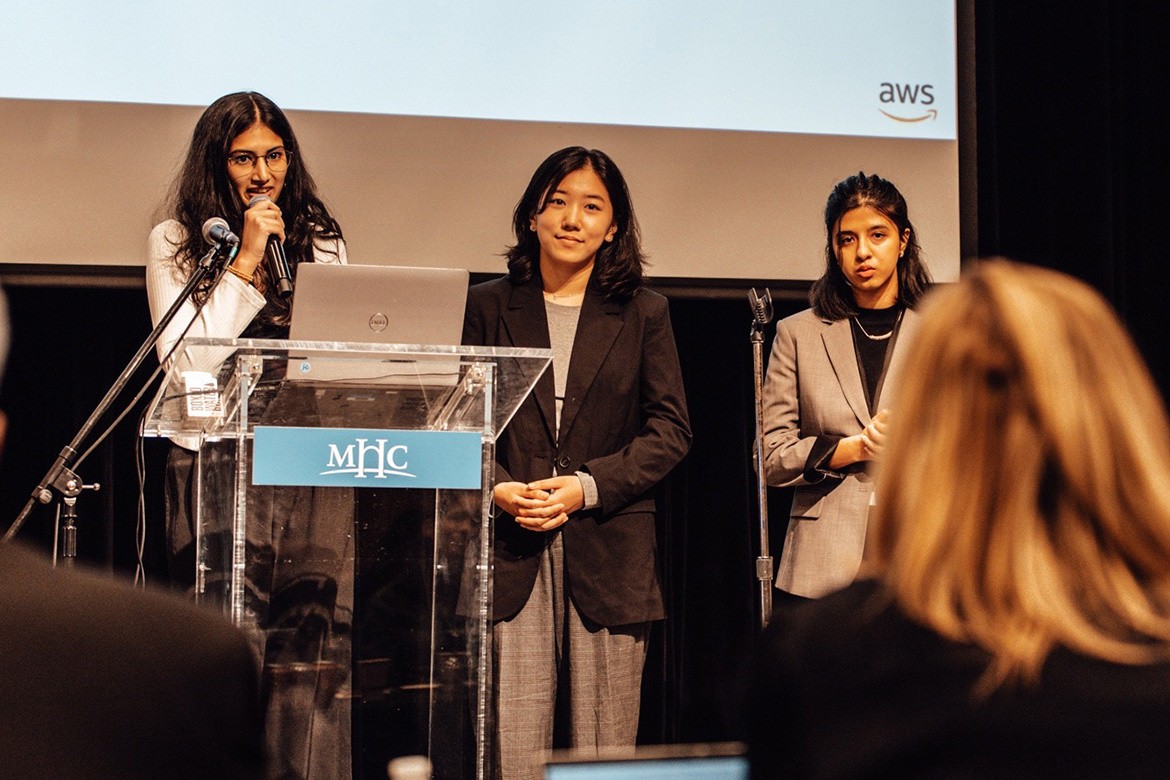 Yurim Oh ’26 (center) and the EHCAI team at the AWS Case Competition