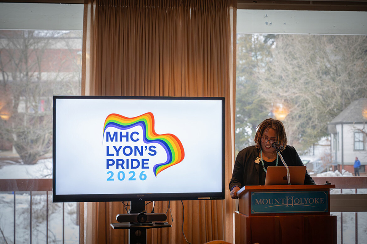 Kijua Sanders-McMurtry speaks from a podium to the attendees of Lyon's Pride Conference 2026.