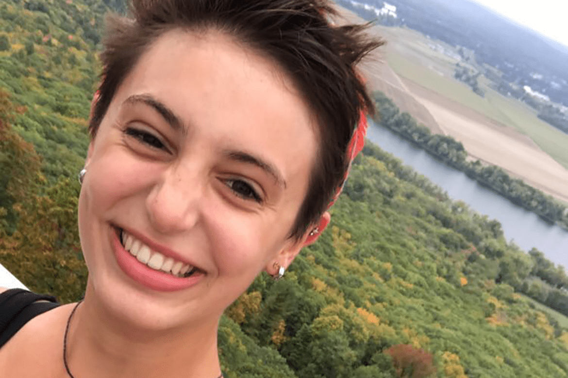 Isabel DiBiasio-Hudson atop Mount Holyoke on Mountain Day