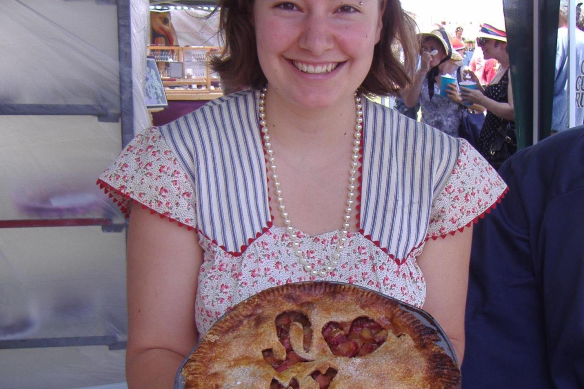 Iris with a pie she baked for the Museum as part of a summer fundraiser.