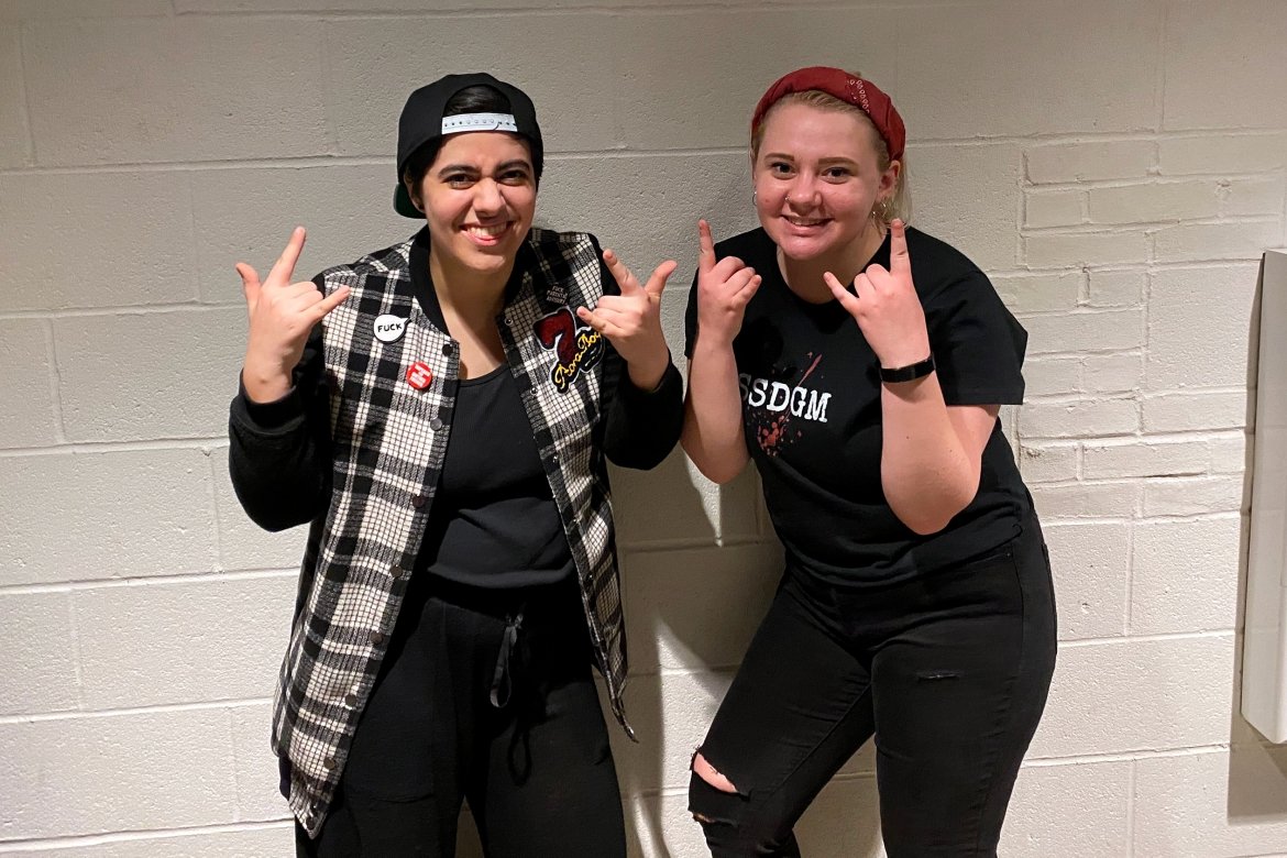 First-year student Gina Pasciuto (left) and sophomore Hannah Dubé (right) take a break from all-day rehearsals for the musical “American Idiot.”  