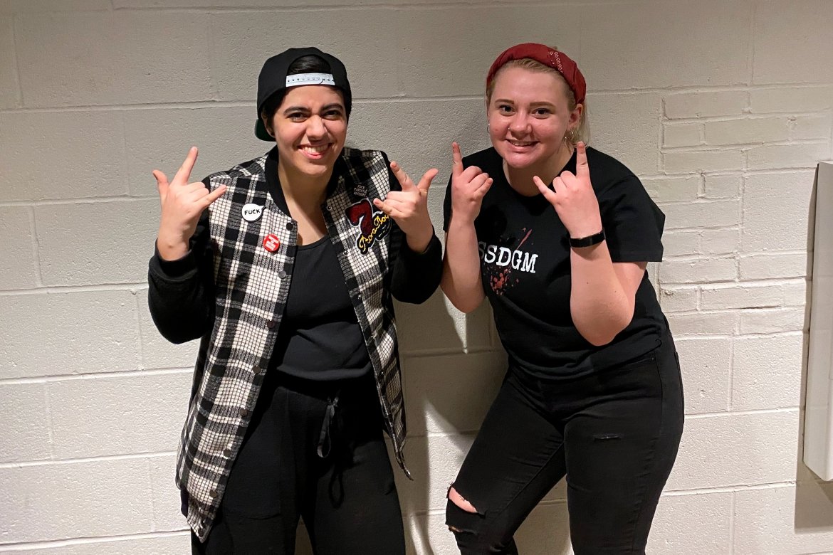 First-year student Gina Pasciuto (left) and sophomore Hannah Dubé (right) take a break from all-day rehearsals for the musical “American Idiot.”