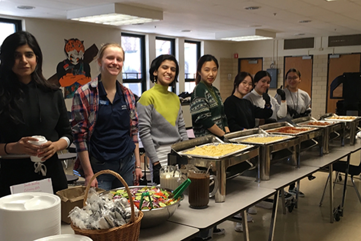 Mount Holyoke’s newest students prepare to serve lunch at the Bag the Community food-pantry event.