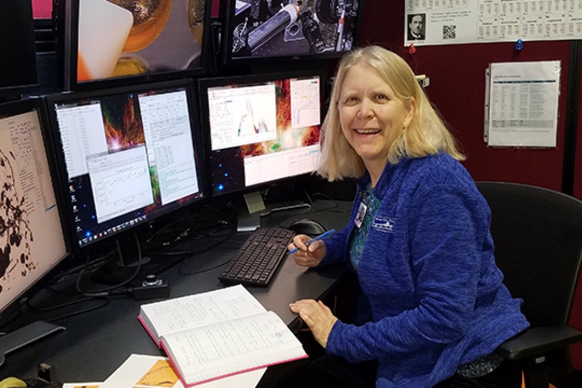 Professor Darby Dyar at the x-ray microprobe instrument at beamline 13 IDE, Advanced Photon Source, Argonne National Laboratory, where she will study pristine lunar material. Photo credit: Molly McCanta