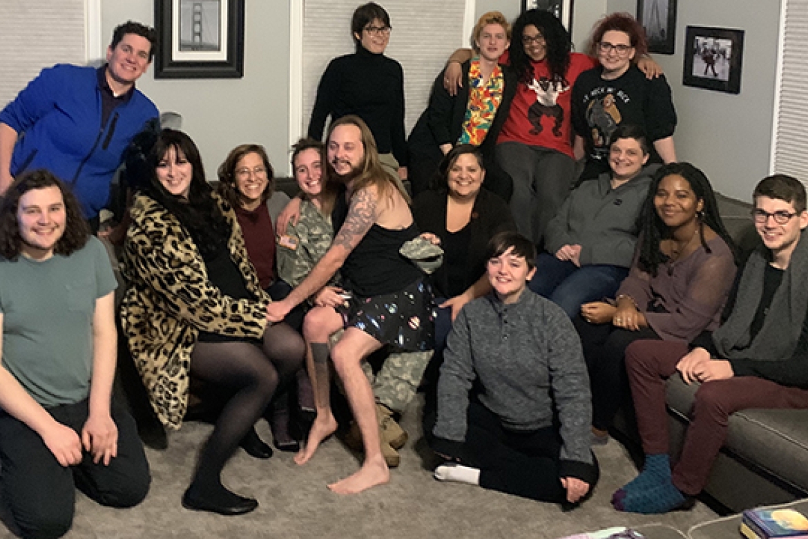 M. Paz Galupo, seated on couch fourth from right, with their students. The lab is devising new scales to capture the experiences of gender and sexuality minorities more fully.