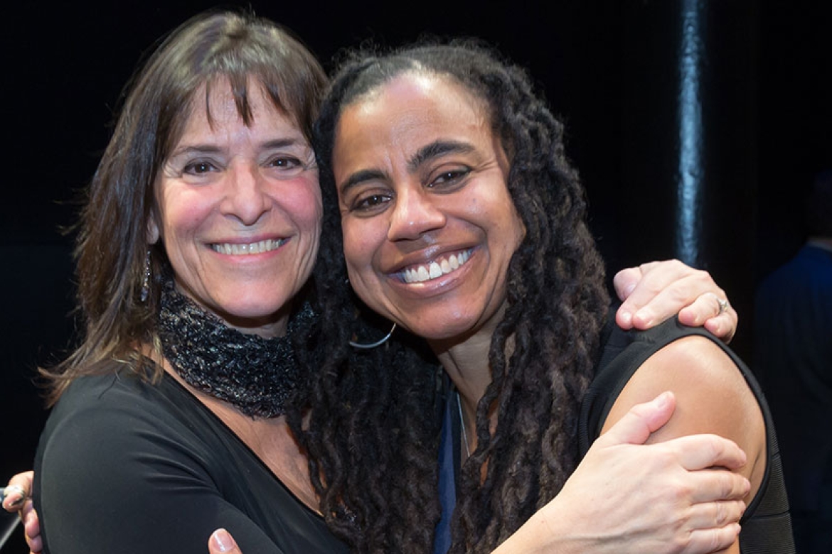 Suzan-Lori Parks and Leah Glasser embrace at the Gish Prize ceremony.