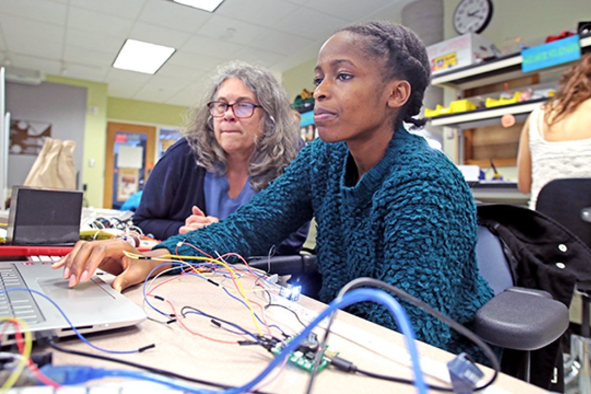 In the College’s makerspace, Tracy Keya ’18 (right), works on her iDesign Studio project, an electronic chameleon that changes color, with her professor, Janet Slocum, visiting lecturer in computer science. 