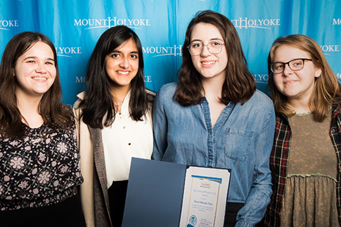 Mount Holyoke News staff pose with their prize for excellence in programming (from left): Zoe Zeligman ’19, Risha Dewan ’18, Lindsey McGinnis ’18 and Emily Blomquist ’18.