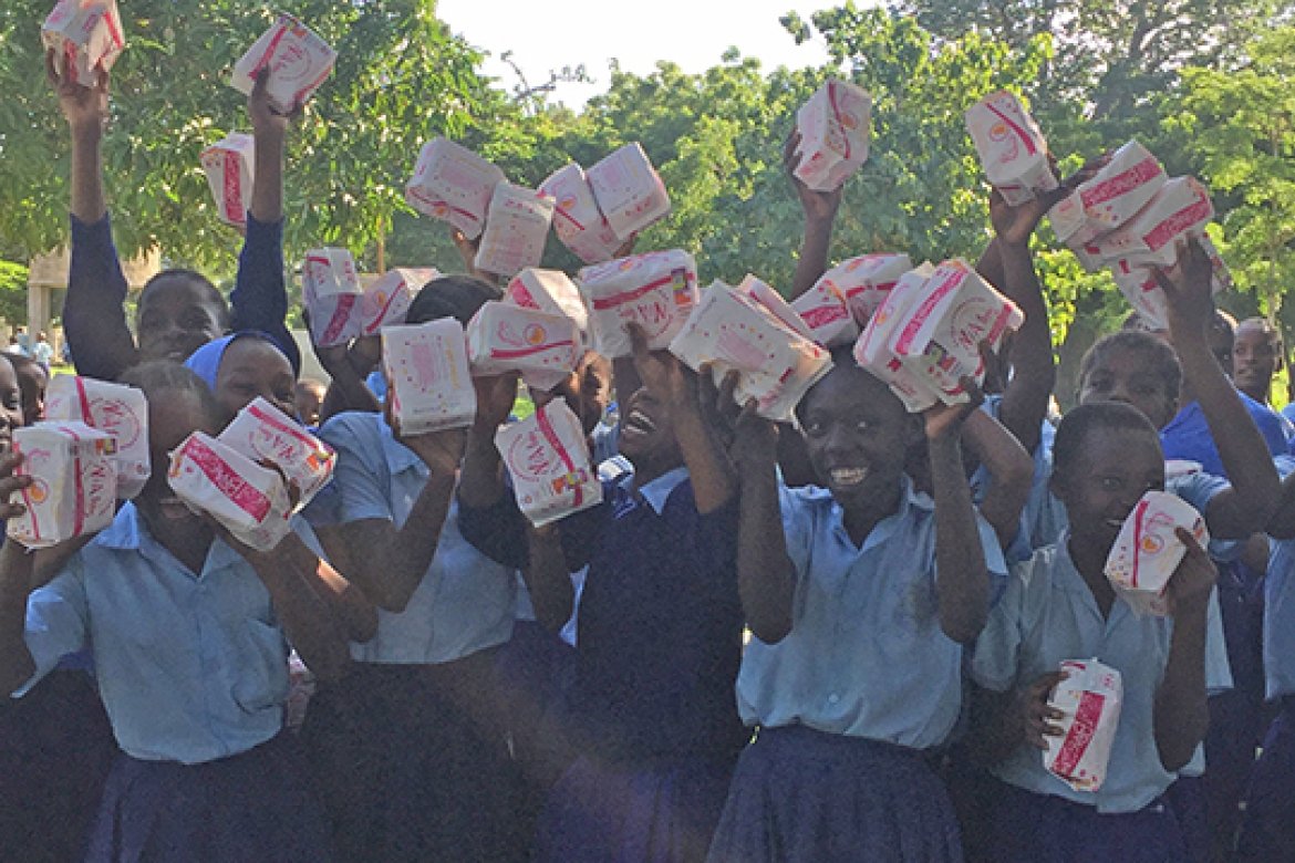 Sexual and reproductive health education and support is critical around the world. Here rural youths celebrate receiving needed supplies. 