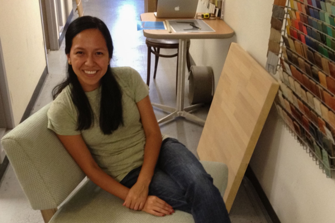 Aleida sitting in a mock-up of a custom chair designed by Thread Collaborative. After confirming all dimensions and judging the chair's overall comfort, the mock-up was approved and moved into production.