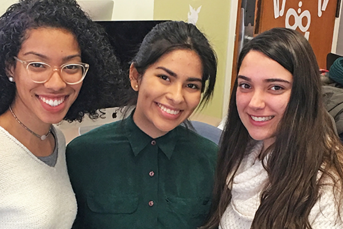 Mount Holyoke students (from left) Relyn Myrthil ’19, Jennifer Villa ’21 and Emilee Aguerrebere ’20 work with high schoolers from the Springfield Renaissance School to learn about art and then make their own.