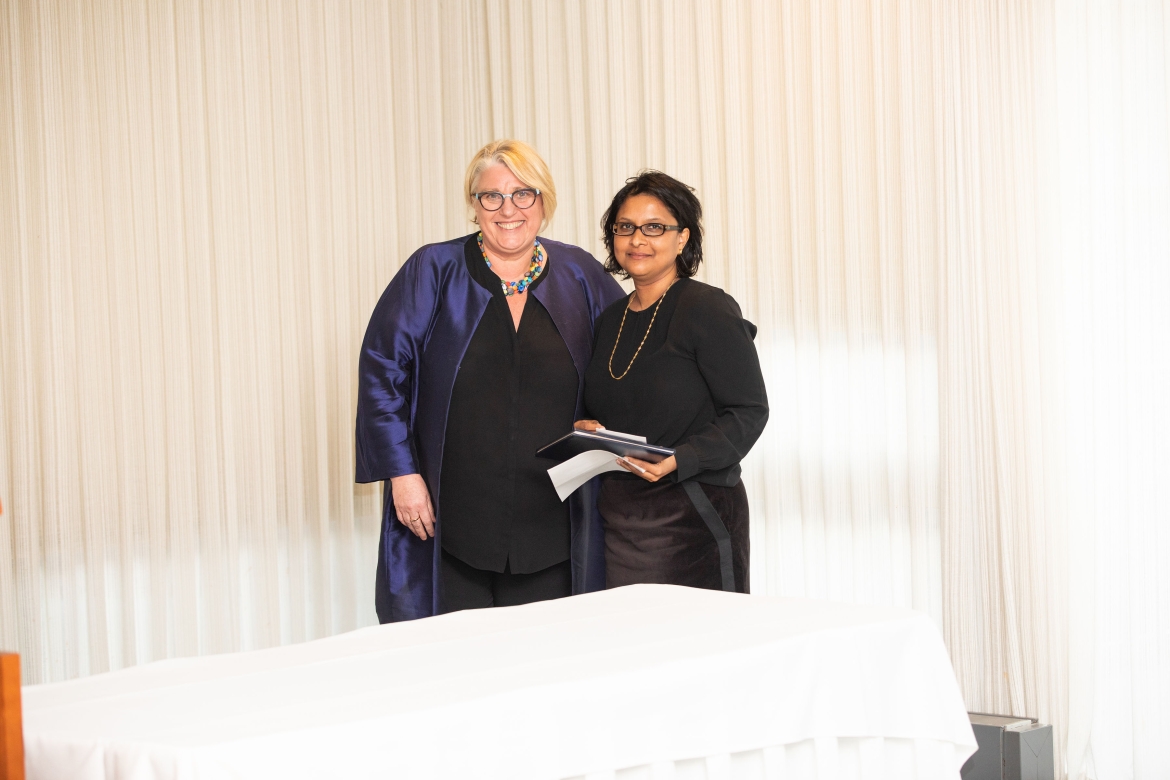 Suparna Roychoudhury (right), associate professor of English, accepted the Meribeth E. Cameron Faculty Award for scholarship from President Sonya Stephens in 2020.