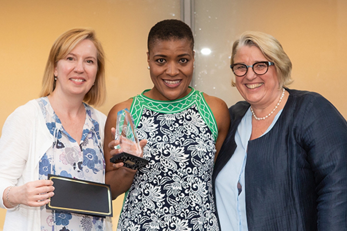 Latrina Denson (center), associate dean of students, received the Mary Lyon Leadership Award from Heidi Friedman (left), director of human resources, and Acting President and President-elect Sonya Stephens (right).