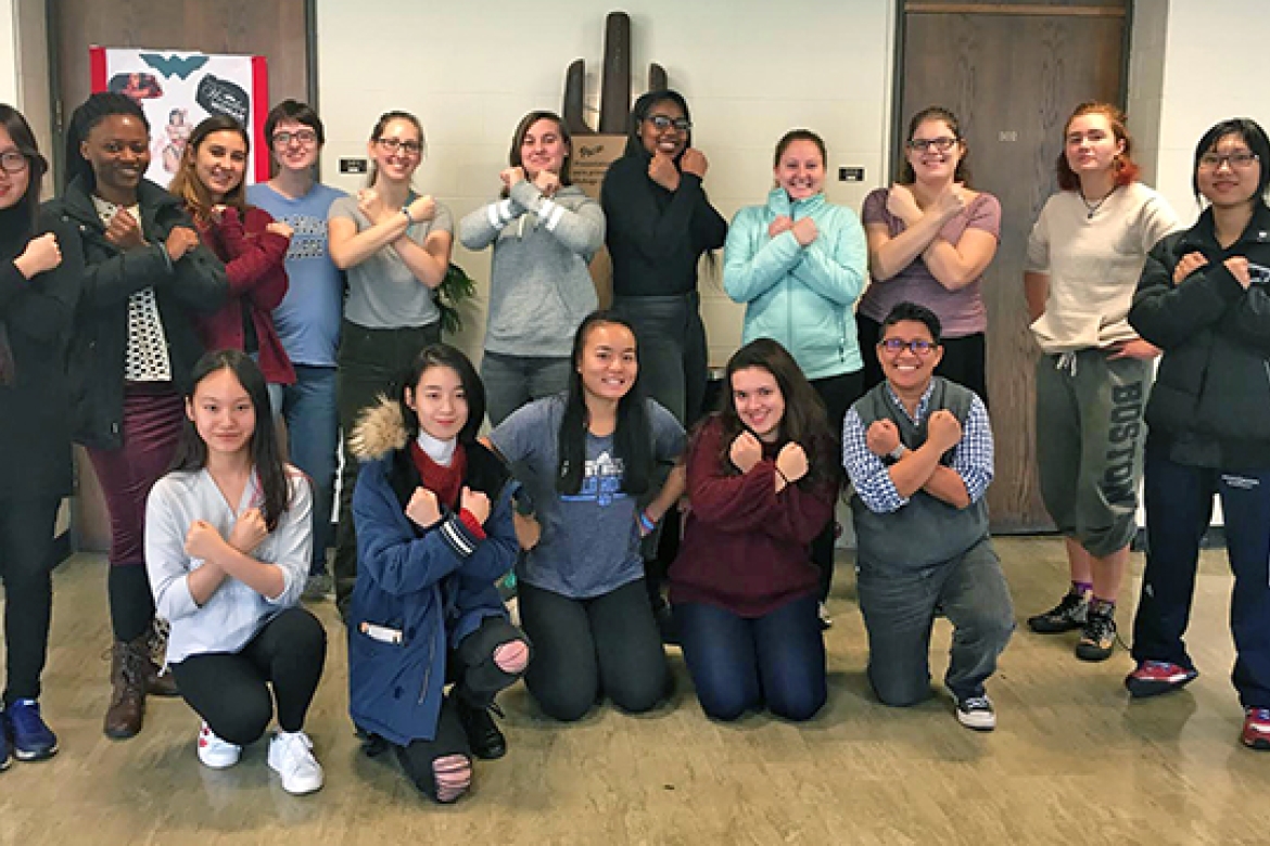 The students of Jennifer Matos’ first-year seminar, Wonder Woman: The Original Social Justice Warrior, strike the heroine’s iconic pose at the end of the semester with their professor (first row, far right). 