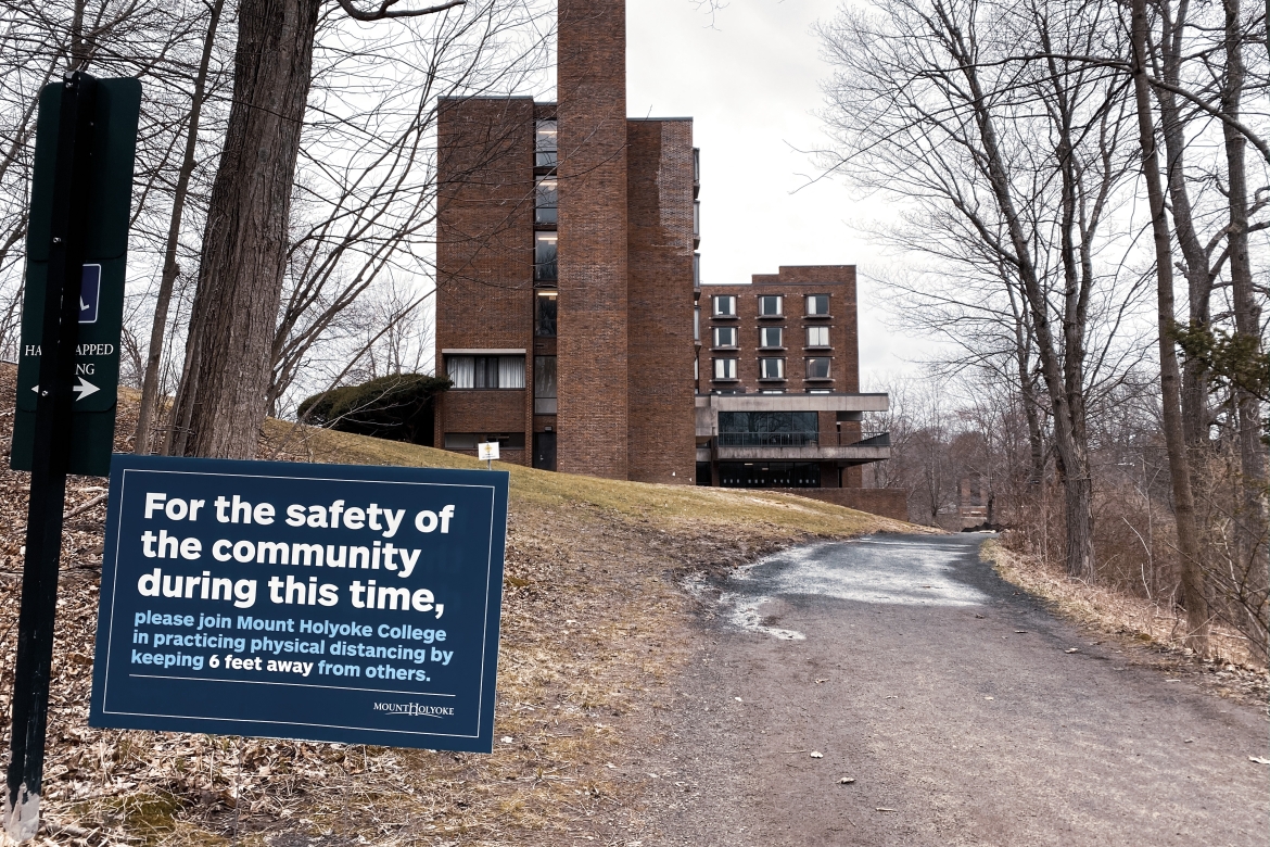 Sign of the times: Campus signs remind those who remain to practice physical distancing during the COVID-19 pandemic.  
