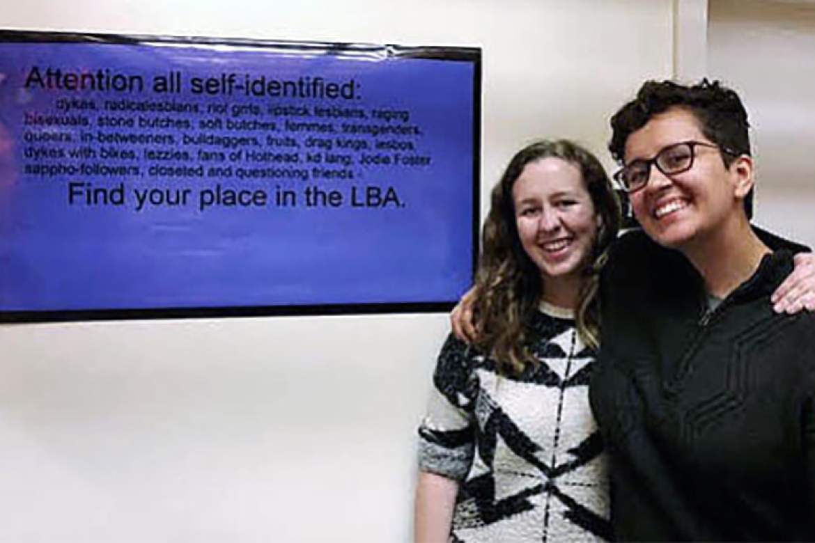 From left, Madeline Fitzgerald ’21 with Chloe Jensen ’20 at an Archives and Special Collections exhibit that Jensen created about the history of LGBTQ+ activism at Mount Holyoke