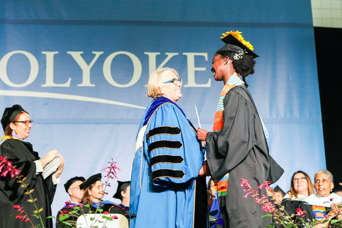 President Sonya Stephens awards Donari Yahzid her degree at Commencement 2019