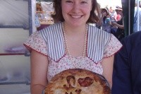 Iris with a pie she baked for the Museum as part of a summer fundraiser.