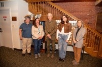 Faculty, staff, and a student pose together for David Crockett Graham archival project.