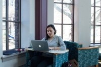 Student on a laptop in the library.