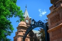 Campus beauty shot of Mount Holyoke's clocktower and gate. Taken in the summer of 2024 by Max Wilhelm.